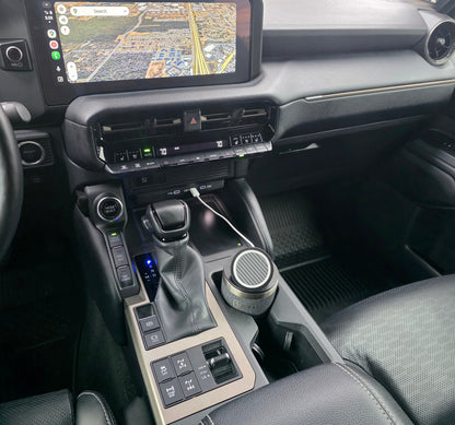 Truck cab with a YETI cup MagSafe stand in the console cupholder and navigation on the dash screen