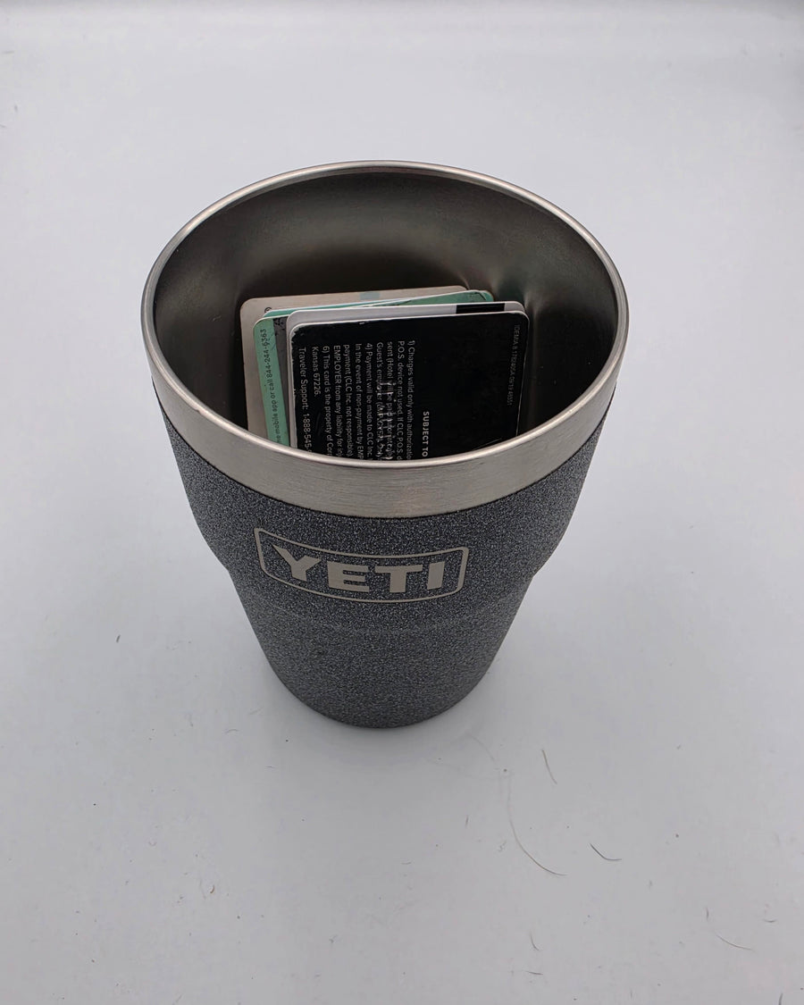 A YETI tumbler with the mount removed, holding a stack of cards inside